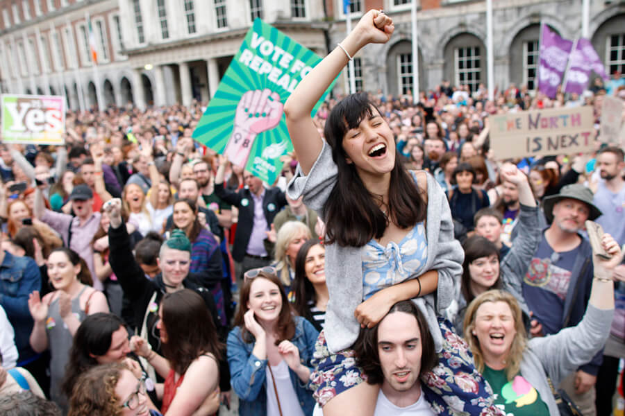 Irish abortion referendum Photograph of Irish citizens celebrating on May 26th, 2018, after passage of a referendum to repeal a broad abortion ban enshrined in the country’s Constitution. Democratic deliberation played a key part in the genesis of the referendum to overturn this constitutional rule. The Irish Parliament went on to legalize abortion during the first 12 weeks of pregnancy, and later if the mother’s health is at risk.