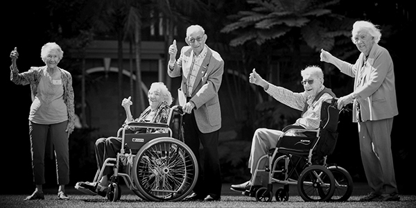 Australian centenarians Maya Sonnenburg, Isabel Paterson, Victor Lilienthal, Albert Lowcock and Joan Wilson give a photographer the thumbs up outside the Queensland Parliament building in Brisbane, wh