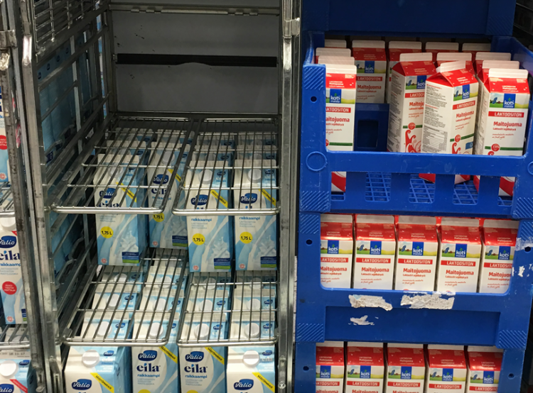 Empty shelf of low-fat “blue” milk and barely touched full-fat “red” milk in North Karelia supermarket