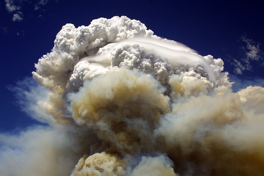 Photo shows a large cloud created by a wildfire.