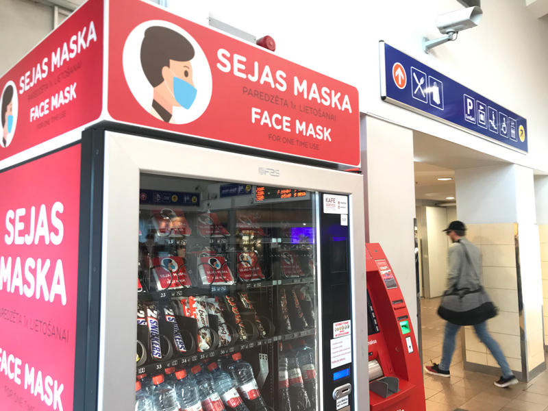Photo shows a vending machine that sells individually wrapped face masks, among other items, for sale.