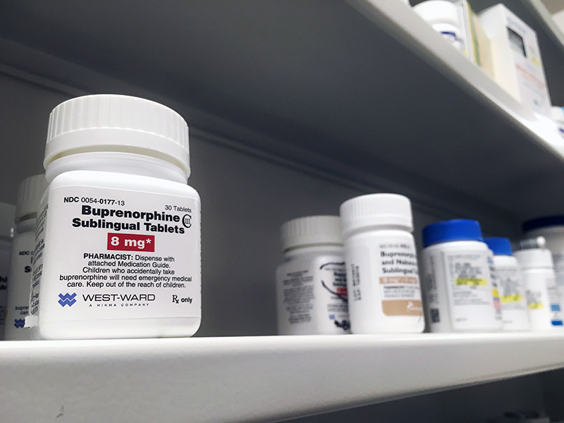 A bottle of buprenorphine tablets sits on a pharmacy shelf
