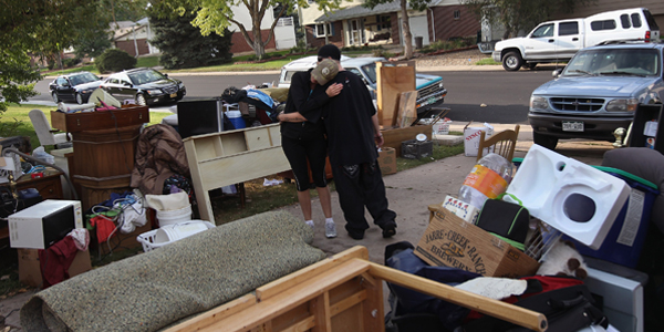 A family’s possessions spread across their lawn after they were evicted from their rented home.