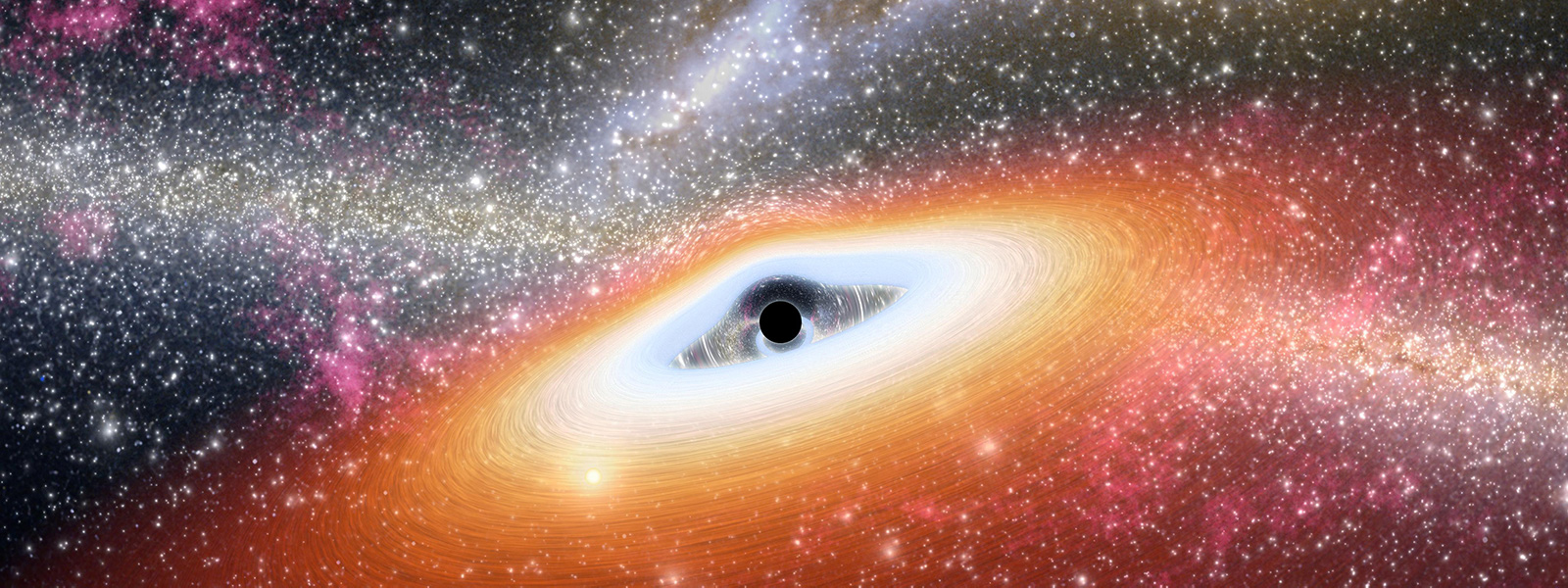 An artist’s conception of a primitive, supermassive black hole surrounded by a star-filled early galaxy.