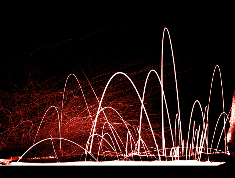 A still created from a high-speed video camera and special lighting show the steep climb and fall of larger water droplets flushed from a toilet as well as the fainter trajectories of smaller droplets.