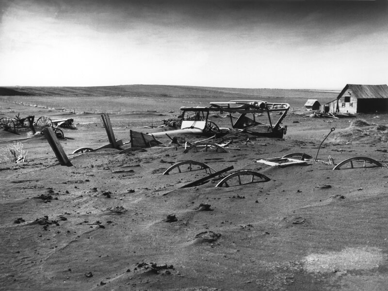 Photo shows a bleak 1936 Dust Bowl scene in South Dakota.
