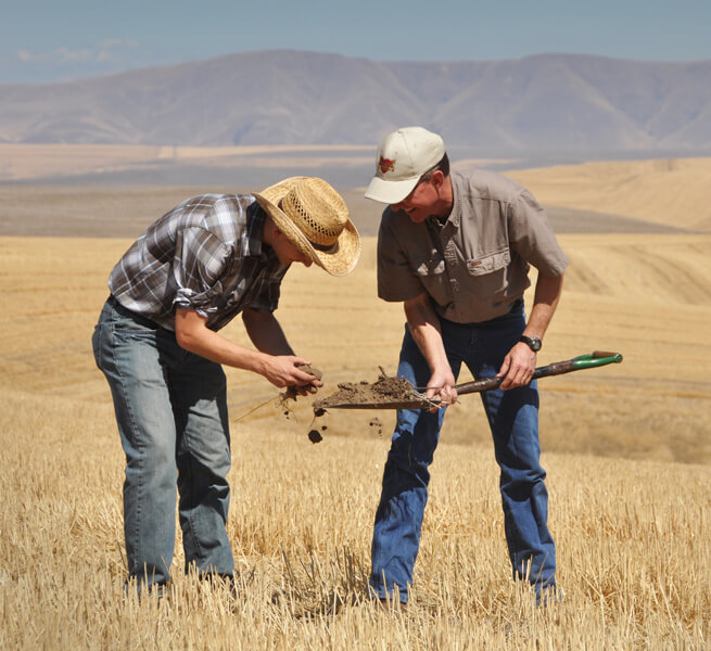 Photo shows USDA soil conservationists at work in Oregon in 2014.