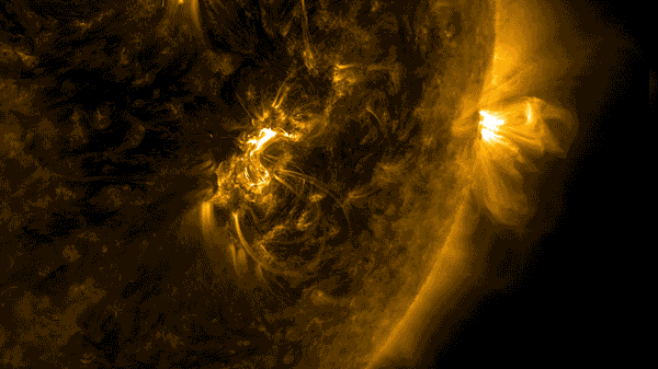 Close up of filaments erupting from surface of glowing sun.