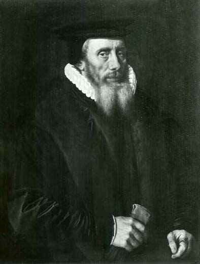 Portrait of a man with a beard wearing a hat, ruffled white collar and dark coat.
