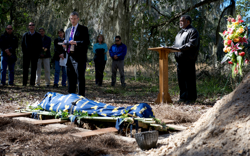Photograph of Joseph Fitzgerald being laid to rest at the Prairie Creek Conservation Cemetery in Gainesville, Florida, wrapped in a cotton shroud. “Green” burials like this are becoming increasingly p