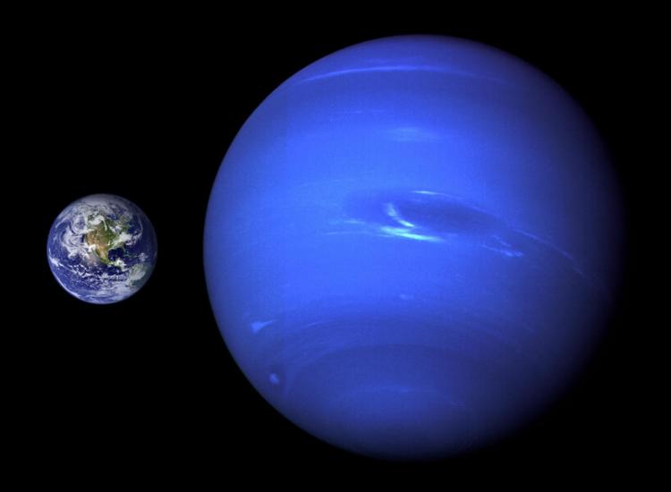A composite image shows the size of Earth relative to the size of Neptune.