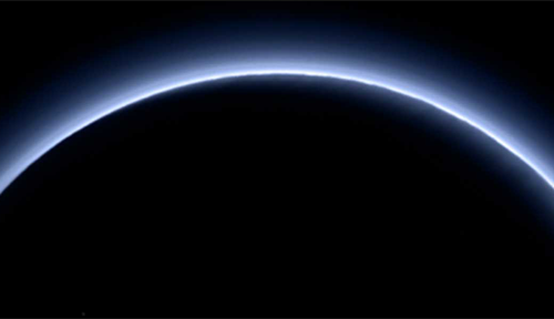 The atmosphere of Pluto is visible as a layer of bluish haze in this near-true color image taken by New Horizons in July 2015. The image was taken by the New Horizons Ralph/Multispectral Visible Imaging Camera (MVIC). This image was generated by software that combines information from blue, red and near-infrared images to replicate the color a human eye would perceive as closely as possible.