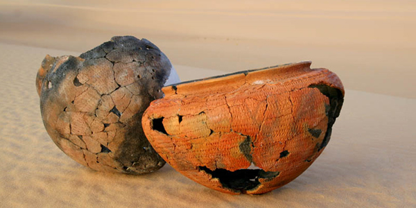 Photo shows vessels that have been restored from fragments found in the Libyan Sahara thought to be more than 6,000 years old.
