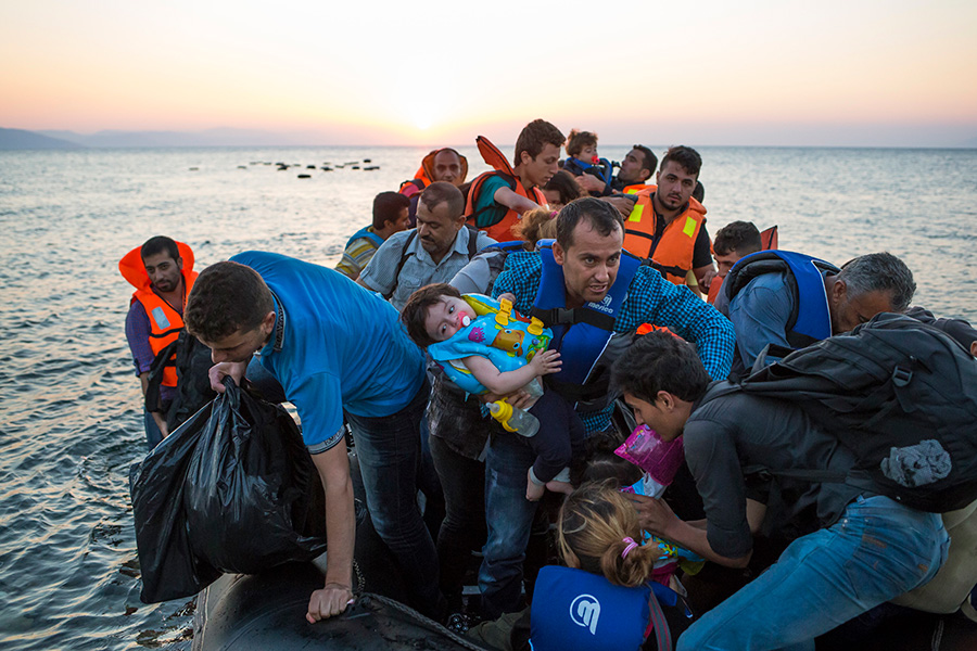 A boat full of Syrian refugees arrives in Greece