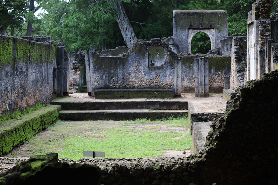 The courthouse at Gedi Ruin complex includes mossy stone walls with windows.