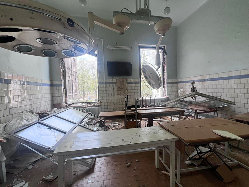 Collateral damage A blown-out operating room littered with broken equipment and debris.