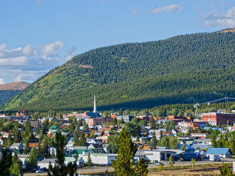 A small city nestled into forested mountains