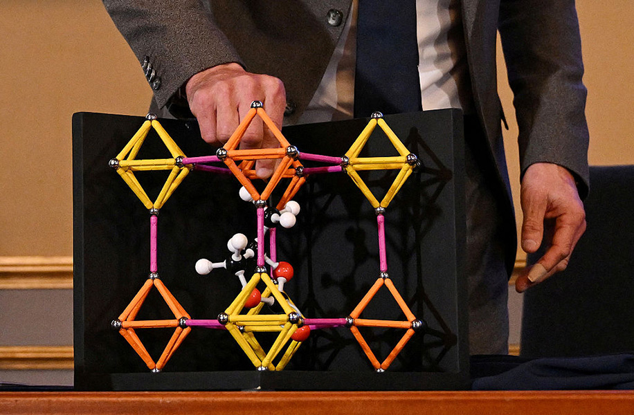 MOFs A plastic molecular model shows a lattice of crystals linked by organic molecules.