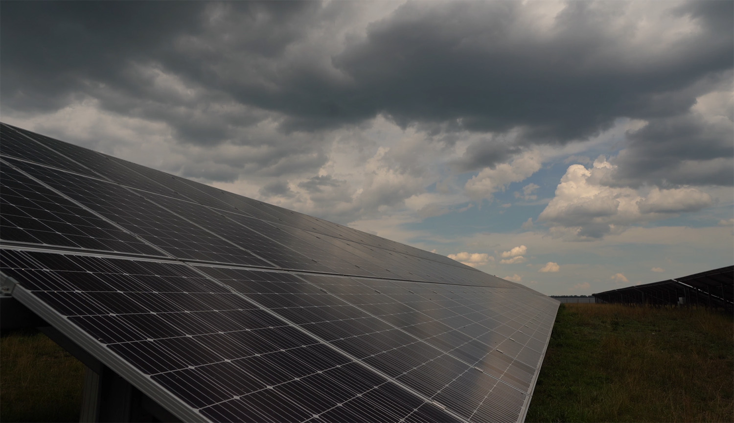 Little movie of a solar panel, over which clouds are slowly rolling on a gloomy day.